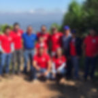 A group of farmers wearing red t-shirts that are responsible for sourcing coffee beans for Foxtail Coffee.